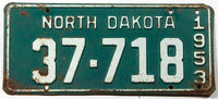 An antique 1953 North Dakota passenger car license plate in very good minus condition