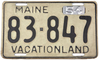 A classic 1954 Maine car license plate in very good plus condition