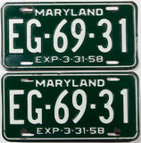 A pair of 1958 Maryland car license plates in very good plus condition with a bend in 1 plate