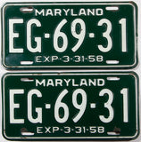 A pair of 1958 Maryland car license plates in very good plus condition with a bend in 1 plate