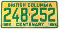 A classic 1958 British Columbia passenger car license plate celebrating the centennial and grading excellent
