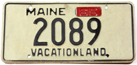 A classic 1965 Maine car license plate in very good plus condition
