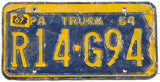 A 1967 Pennsylvania Truck license plate in good condition with many bumps and bends