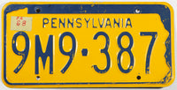 A vintage 1968 Pennsylvania Car License Plate in very good condition with a homemade sticker