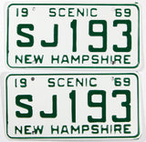 A pair of NOS 1969 New Hampshire car license plates in near mint condition with wrapper
