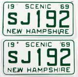 A pair of NOS 1969 New Hampshire car license plates in near mint condition with wrapper