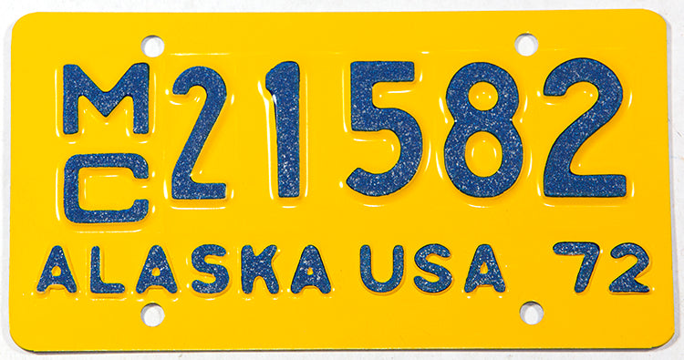 A classic NOS 1972 Alaska motorcycle license plate in NOS Near Mint condition