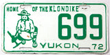 A 1972 Yukon passenger car license plate in very good plus condition with bends