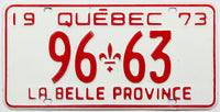 A classic 1973 Quebec passenger car license plate in excellent minus condition