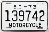 A classic 1973 British Columbia motorcycle license plate in New Old Stock Excellent Plus condition