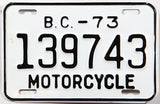 A classic 1973 British Columbia motorcycle license plate in New Old Stock Excellent Plus condition
