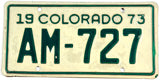 A vintage 1973 Colorado motorcycle license plate in excellent minus condition
