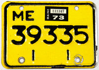 A classic 1973 Maine motorcycle license plate in excellent minus condition