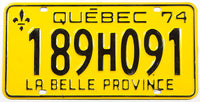 A classic 1974 Quebec passenger car license plate in excellent condition