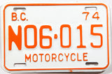 A classic 1974 British Columbia motorcycle license plate in New Old Stock Excellent Plus condition