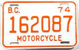 A classic 1974 British Columbia motorcycle license plate in New Old Stock Excellent Plus condition