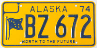 A classic 1974 Alaska passenger car license plate in unused excellent plus condition