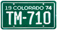 A NOS 1974 Colorado Motorcycle License Plate in excellent condition