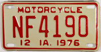 A classic NOS 1976 Iowa motorcycle license plate which will grade excellent plus