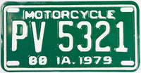 An antique NOS 1979 Iowa Motorcycle License Plate that is in excellent condition