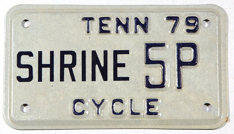 A classic 1979 Tennessee Shriners Motorcycle License Plate in NOS Excellent Minus condition
