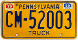 A classic 1980 Pennsylvania truck license plate in very good condition