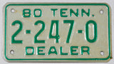 A classic 1980 Tennessee Motorcycle Dealer License Plate in excellent minus condition