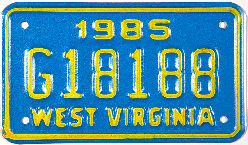 1985 West Virginia motorcycle license plate which is unused and will grade near mint