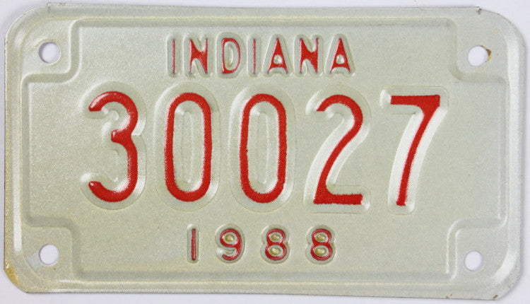 A New Old Stock 1988 Indiana Motorcycle License Plate grading Excellent