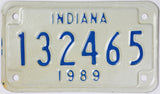 A NOS 1989 Indiana Motorcycle License Plate which is in Excellent Minus Condition