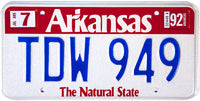 A classic 1992 Arkansas passenger car license plate which is unused and will grade NOS Near Mint