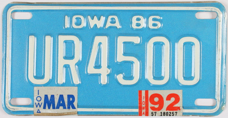 A 1992 Iowa Motorcycle License Plate - the color of this 92 IA Bike Tag is blue with white letters