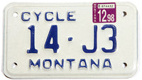 A 1998 Montana motorcycle license plate in excellent condition