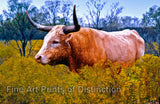 An archival premium quality art print of a Texas longhorn cow in a field with yellow wildflowers for sale by Brandywine General Store
