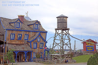 A Museum Quality Print of the Hatfield and McCoy's Building, Sign and Water Tower for sale by Brandywine General Store