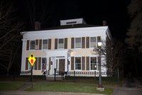 A premium quality art print of Yellow House in Cooperstown at Night with Street Lamp