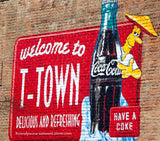 art print of coca cola ad painted ad on brick building with T-town