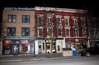 A premium quality art print of Cooperstown Baseball Bat Company at night