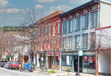 A premium quality art print of Cooperstown NY Storefronts on Main Street selling mainly baseball memorbilia and supplies