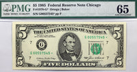 A FR #1978-G* star note from the 1985 series and issued by the Federal Reserve Bank in Chicago grading PMG 65