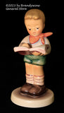 A Goebel Hummel Honor Student #2087/B figurine with trademark 8