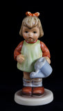 A Goebel Hummel figurine titled Nature's Gift from trademark 7
