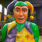A premium quality art print of Mardi Gras Jester in Front of Beaded House 