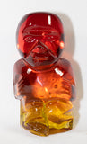 A Kanawha small hand blown glass amberina tiki figurine