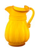 A Kanawha Mid Century Style small gold color pitcher with long diamond shaped ribs and ruffled top