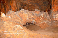 A fine art print of a large bridge in mostly brownish red colors inside Luray Caverns