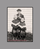 An art print of Three Children and a Kitten from an Antique Photograph