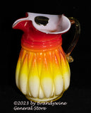 A small Kanawha hand blown amberina pitcher with diamond rib pattern
