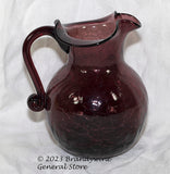 A small Rainbow amethyst hand blown crackle glass pitcher