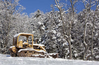 Bulldozer Parked in the Deep Snow at edge of forest Art Print